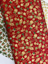 Red cotton with gold, white, red and green baubles.